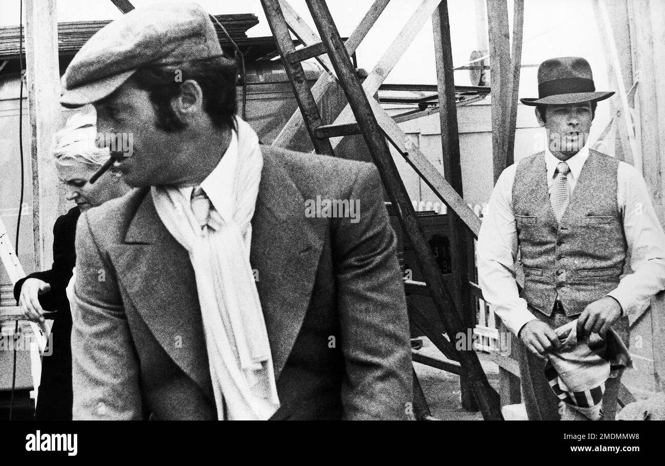 FILE - In this 1969 file photo, French actors Jean-Paul Belmondo. left, and  Alain Delon are seen during the shooting of a Jacques Deray film, "Borsalino"  in Marseille, France. French New Wave