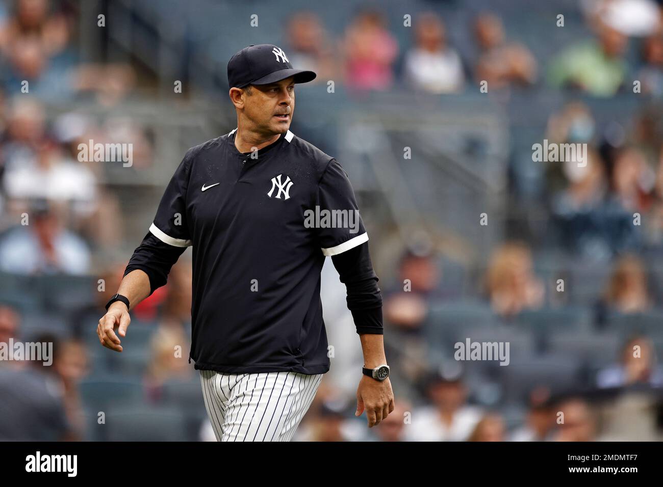 New York Yankees manager Aaron Boone walks to the dugout after being