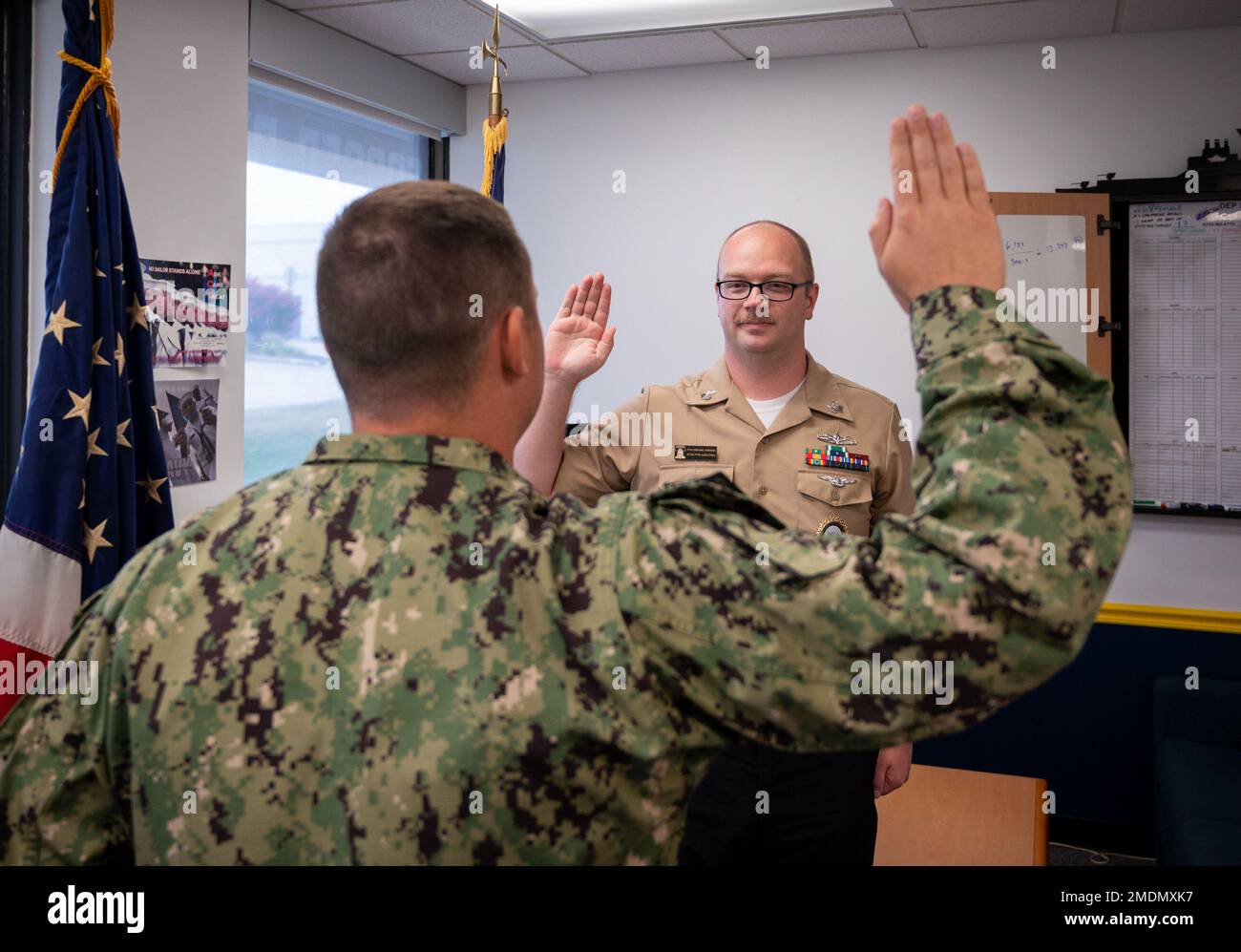 220726-N-WF272-1024 YORK, Pa. (July 26, 2022) U.S. Navy Firecontrolman (Aegis) 1st Class Christopher Odierno, a native of San Diego, assigned to Navy Talent Acquisition Group Philadelphia, reenlists for six more years in the Navy. U.S. Navy Lt. Joshua Udy, a native of Colorado Springs, Colo., enlisted programs officer, served as reenlisting officer during the ceremony held at Navy Recruiting Station York, July 26, 2022. NTAG Philadelphia encompasses regions of Pennsylvania, New Jersey, Delaware, Maryland and West Virginia, providing recruiting services from more than 30 talent acquisition site Stock Photo