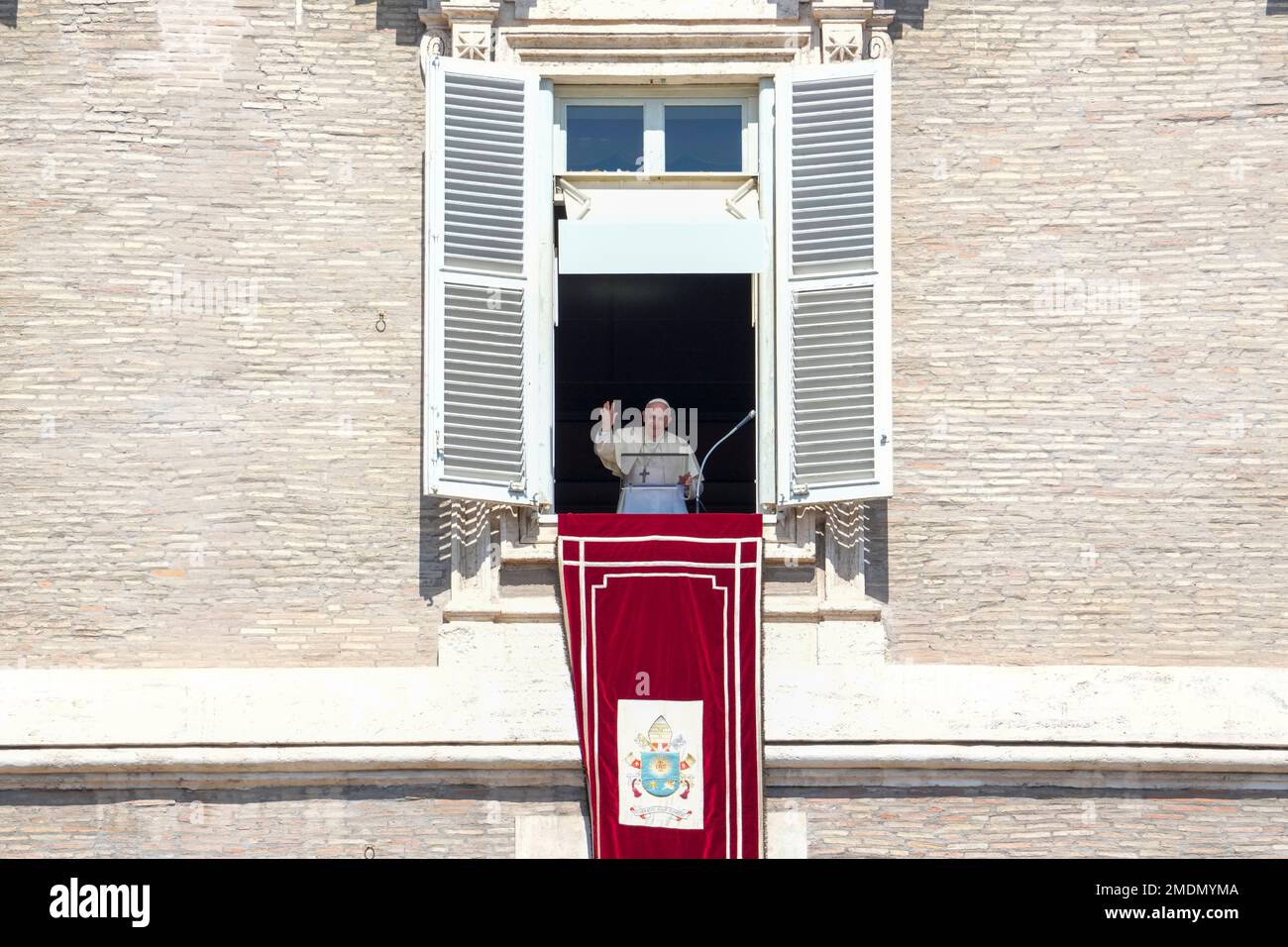Pope Francis delivers his blessing as he recites the Angelus noon ...