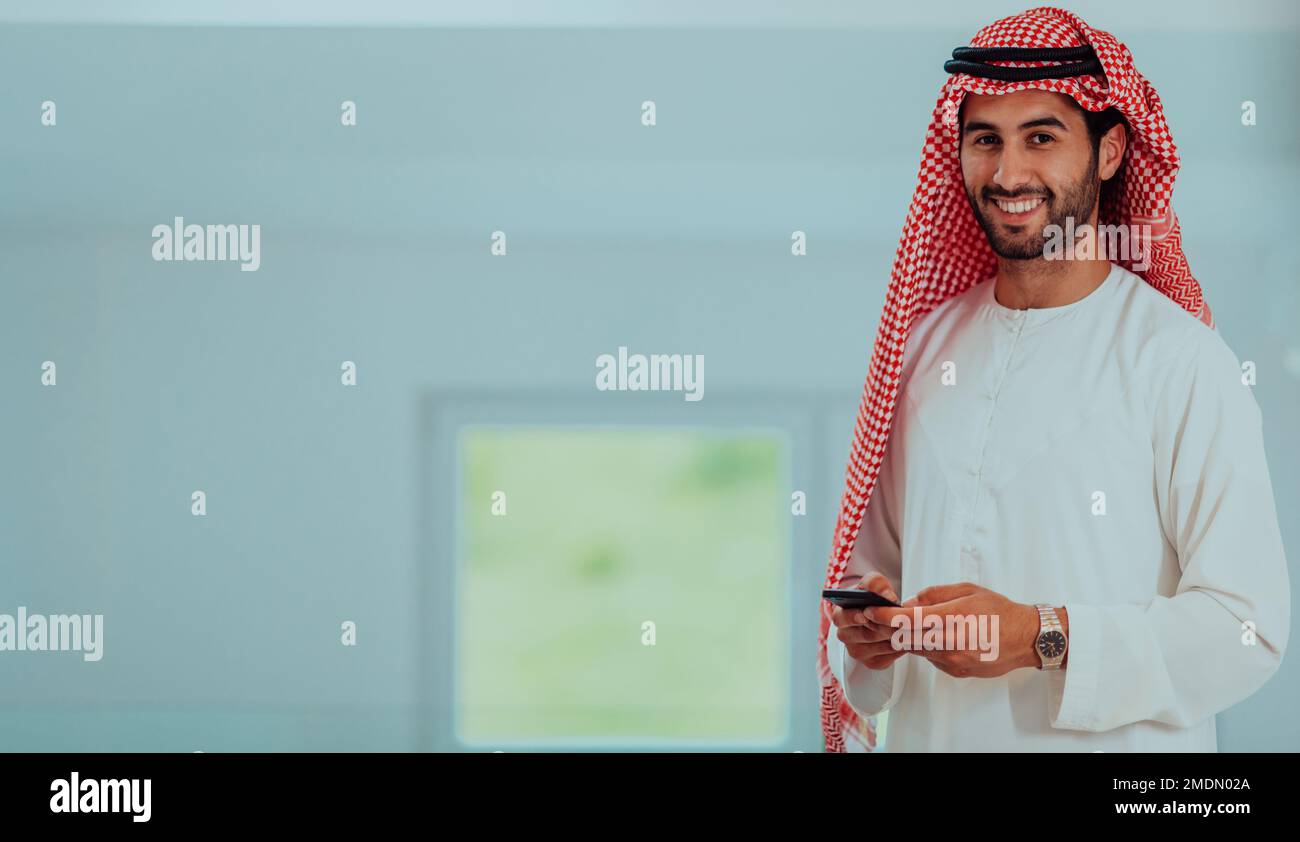 Young modern Muslim Arabian businessmen wearing traditional clothes