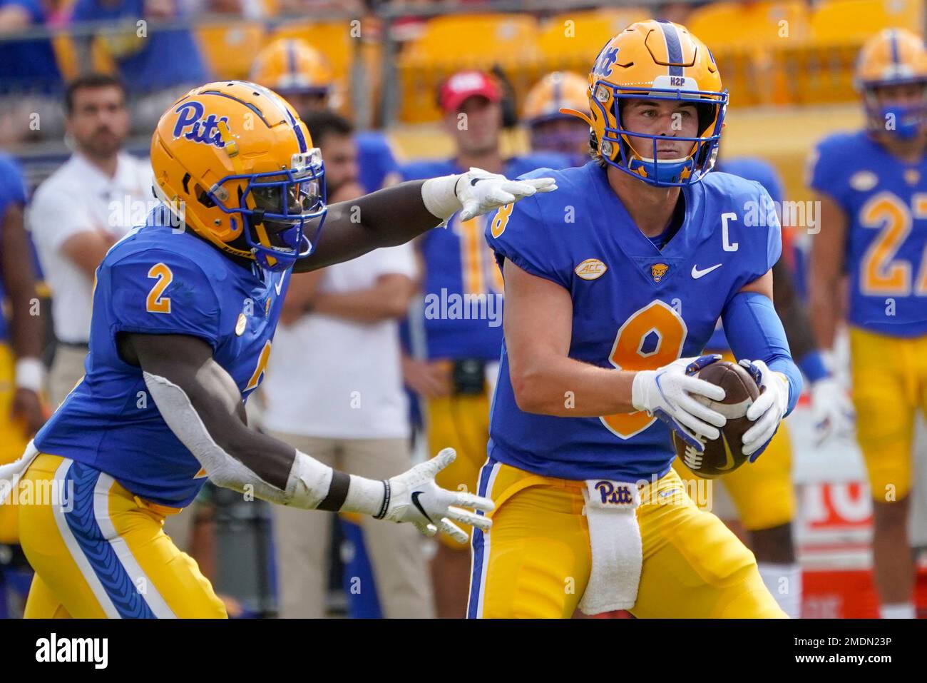 Pittsburgh quarterback Kenny Pickett (8) fakes a handoff to running