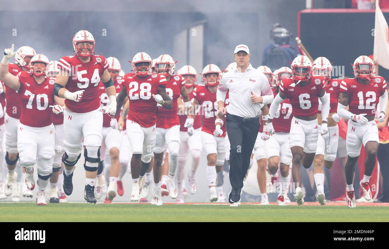 Nebraska head coach Scott Frost leads his team onto the field before