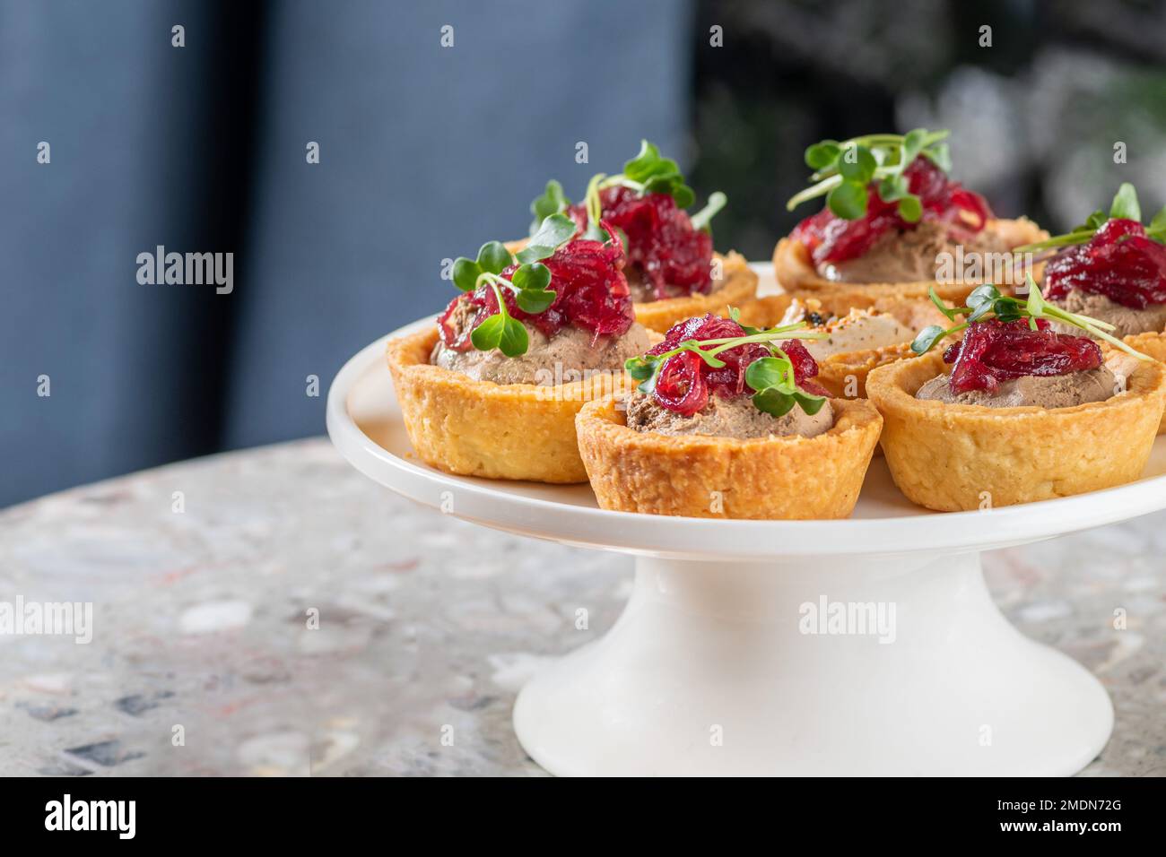 Tartlets stuffed with codfish liver, codfish caviar and microgreens