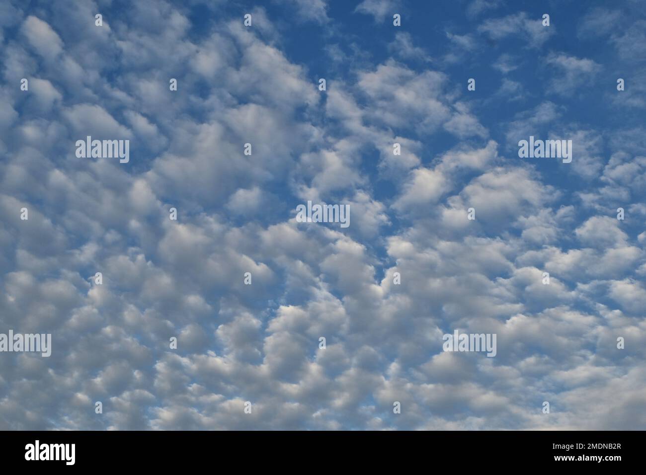 small white clouds against blue sky Stock Photo