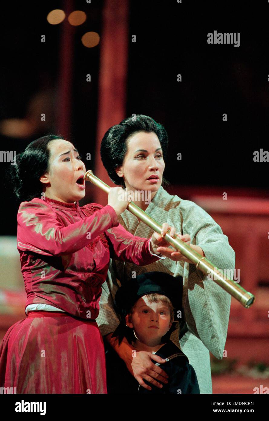 awaiting Pinkerton's return - l-r: Liping Zhang (Madam Butterfly), Marcia Bellamy (Suzuki) with Lachlan Freeman (Sorrow) in MADAM BUTTERFLY by Puccini at the Royal Albert Hall, London SW7  19/02/1998  a Raymond Gubbay production  conductor: Peter Robinson  design: David Roger  lighting: Andrew Bridge  director: David Freeman Stock Photo