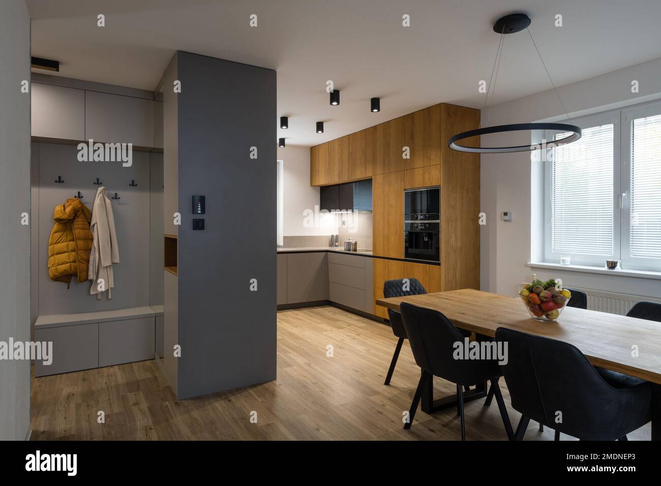 Modern kitchen with built in appliances and dining table Stock Photo ...