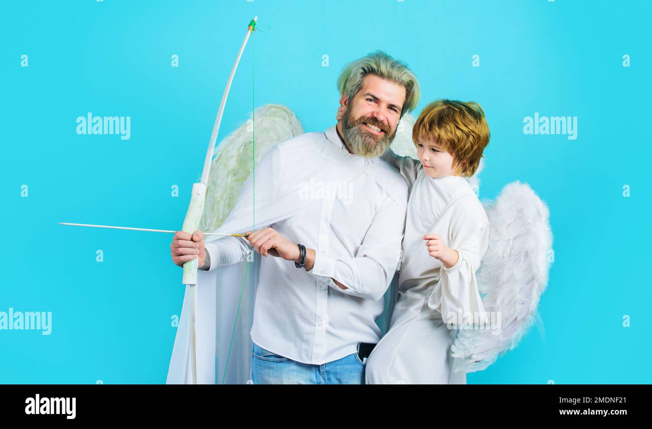 Valentines day. Little cupid boy and father with bow and arrow. Christmas angels. Cute angel. Stock Photo