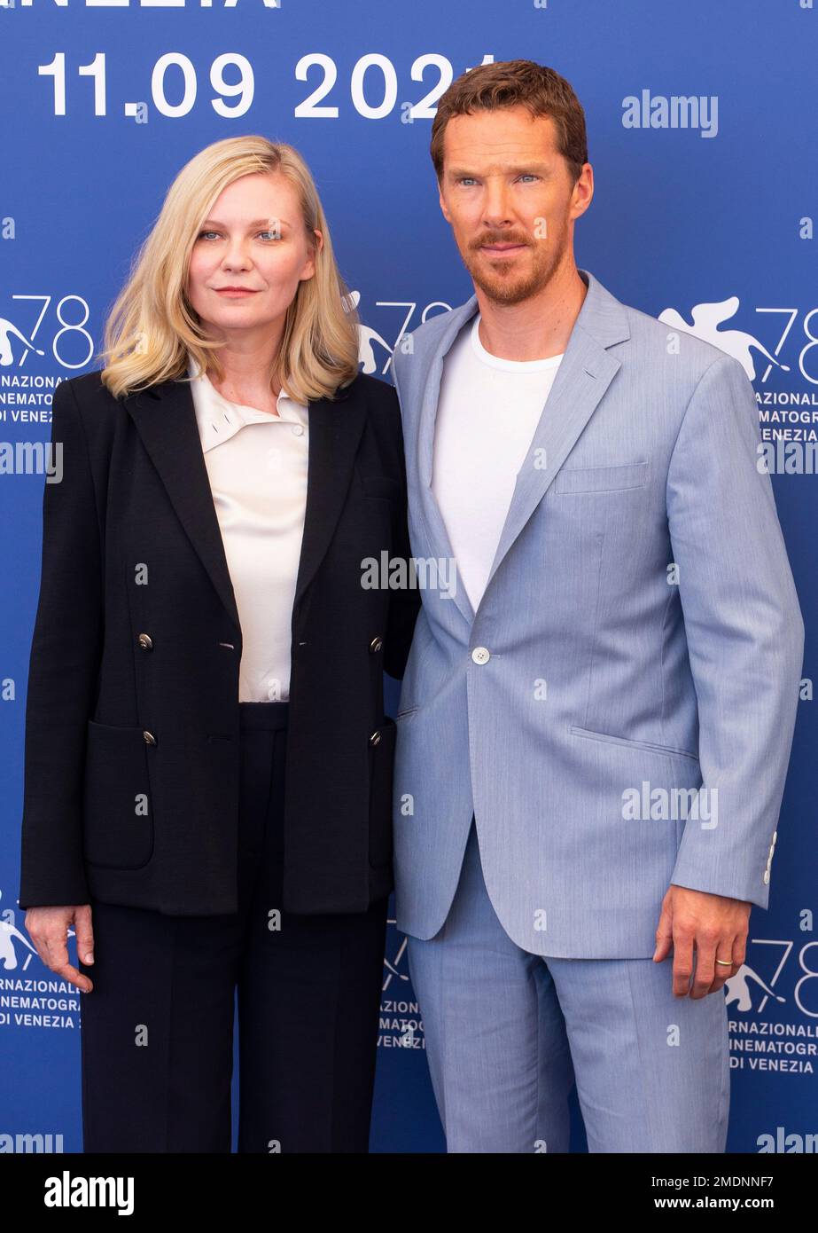 Benedict Cumberbatch, right, and Kirsten Dunst pose for photographers at the photo call for the