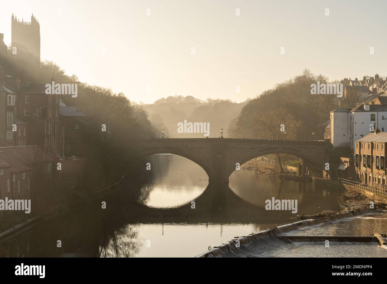 A view of the River Wear and Framwellgate Bridge in the city of Durham, County Durham, UK, in morning sun, with the Cathedral above on the hill. Stock Photo