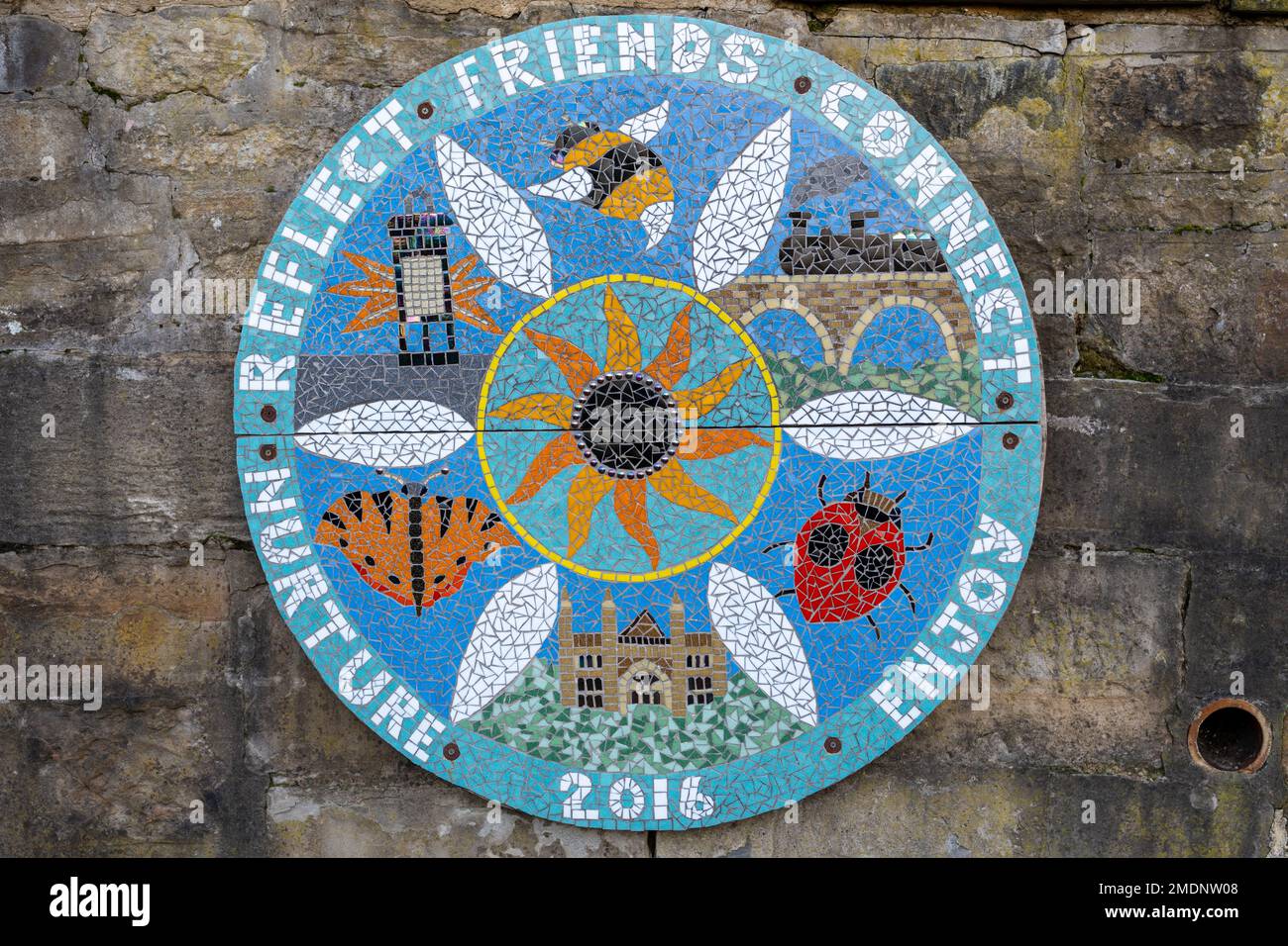 A mosaic plaque in a community garden commemorates its founding, in 2016. In Wharton Park in the city of Durham, County Durham UK Stock Photo