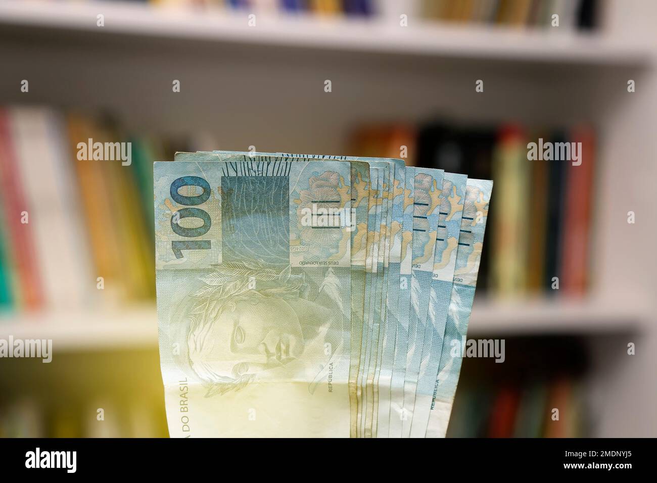 money from brazil stacked on home scene - several hundred real bills Stock Photo