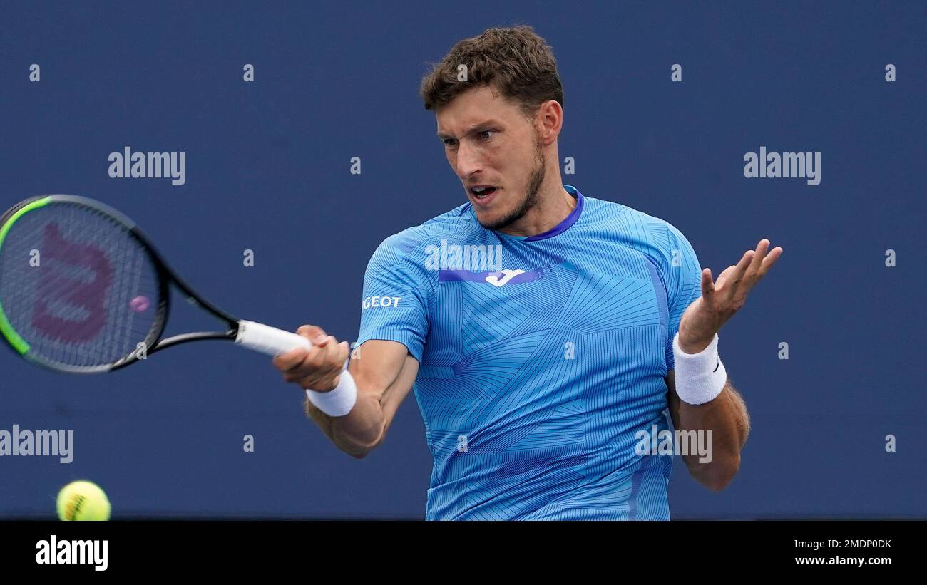 Pablo Carreno Busta, of Spain, returns a shot to Maxime Cressy, of the United States, during the first round of the US Open tennis championships, Tuesday, Aug