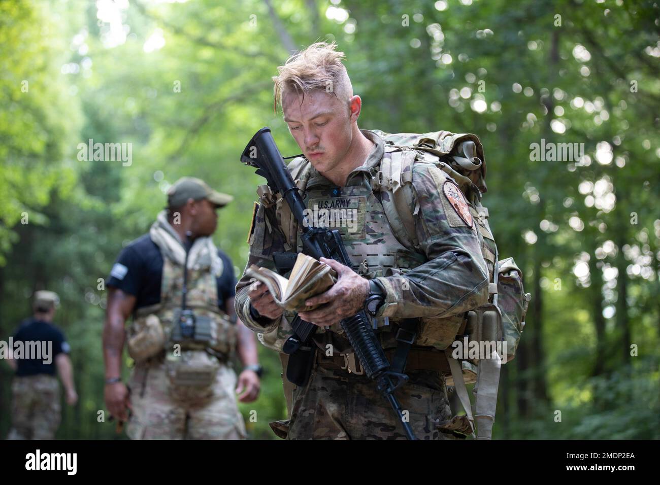 U.S. Army Spc. Austin Manville calls an Unexploded Ordnance (UXO ...