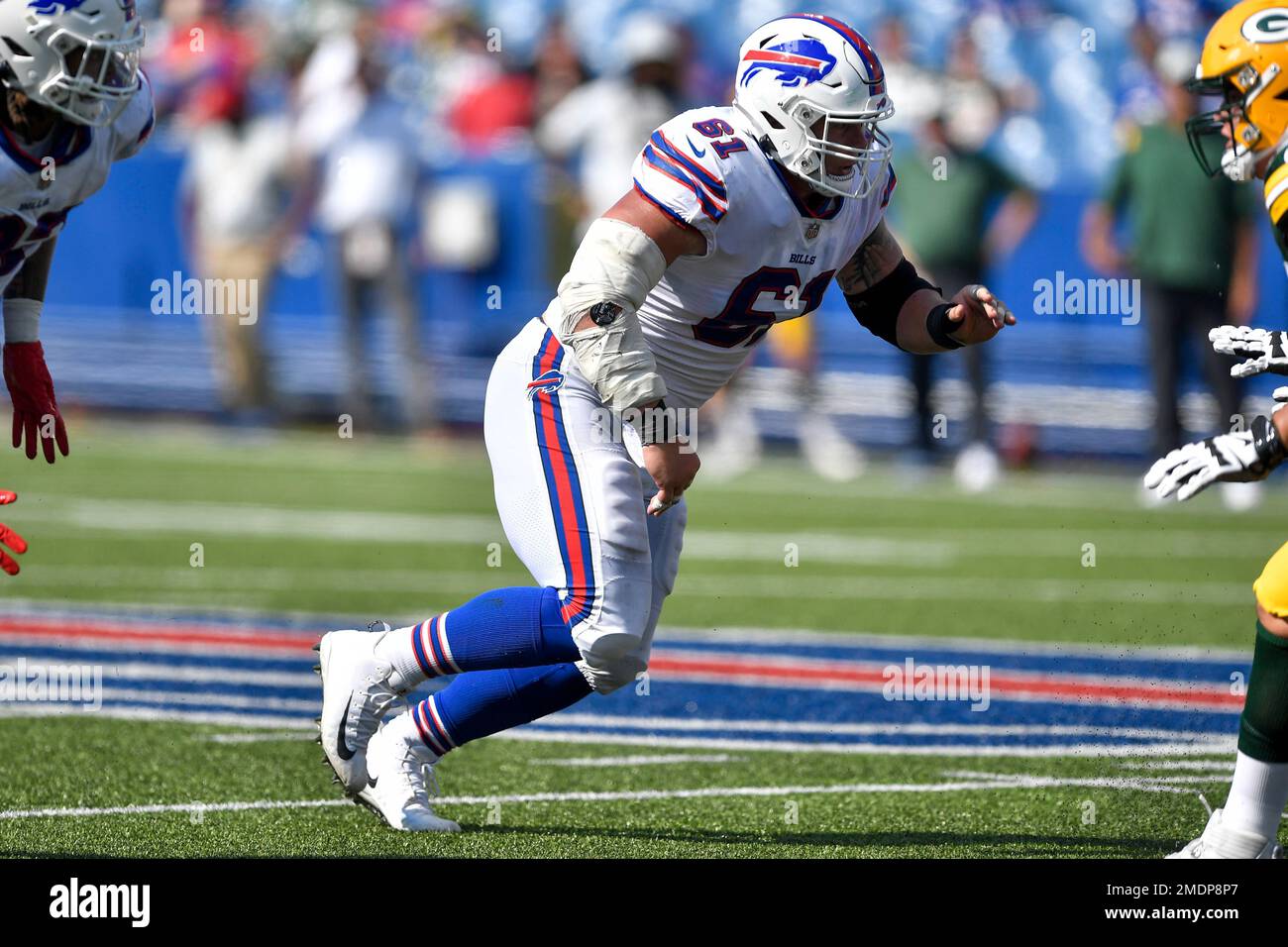 Miami Dolphins quarterback Jacoby Brissett (14) tries to hold off an attack  by Buffalo Bills defensive tackle Justin Zimmer (61) during the second half  of an NFL football game, Sunday, Sept. 19