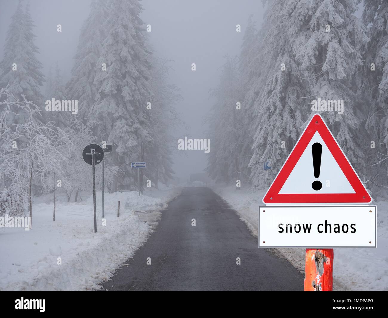 Warning Sign Snow Chaos on the Street Stock Photo