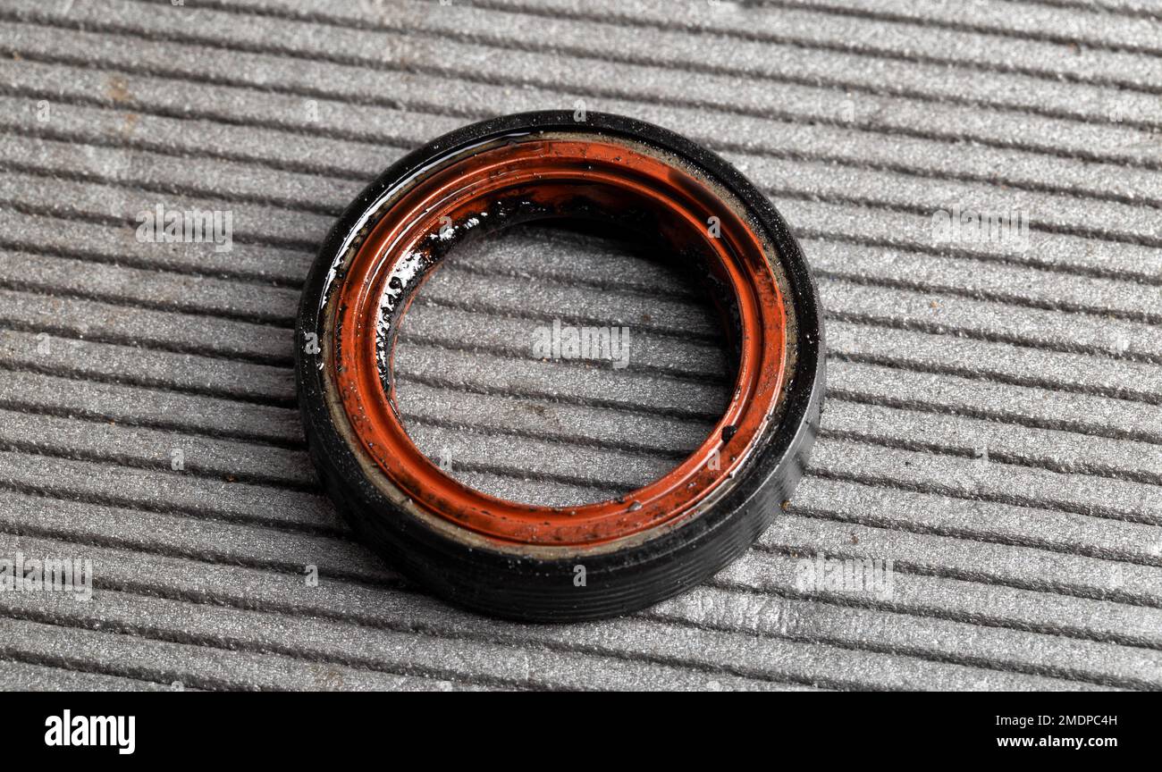 Camshaft oil seal in a car engine on a gray background Stock Photo Alamy