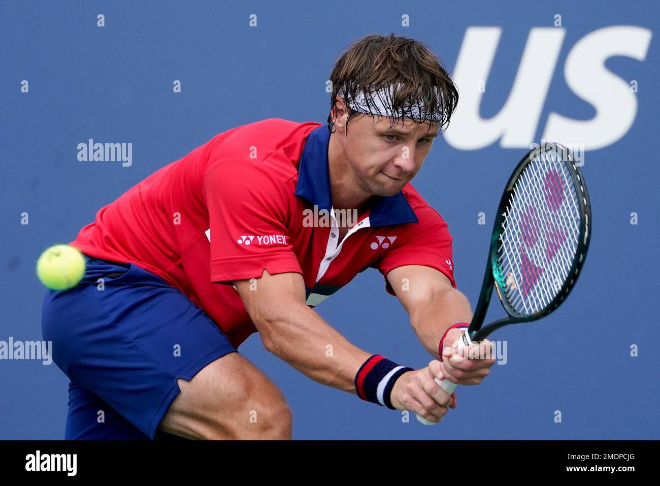 Ricardas Berankis, of Lithuania, returns a shot to Diego Schwartzman, of  Argentina, during the first round of the US Open tennis championships,  Monday, Aug. 30, 2021, in New York. (AP Photo/John Minchillo