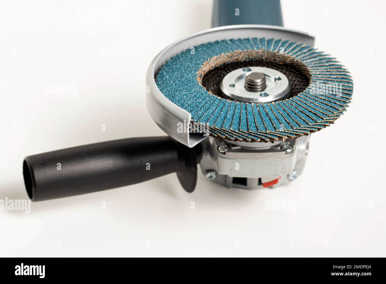 Professional angle grinder with flap wheel for processing wooden surfaces. Construction power