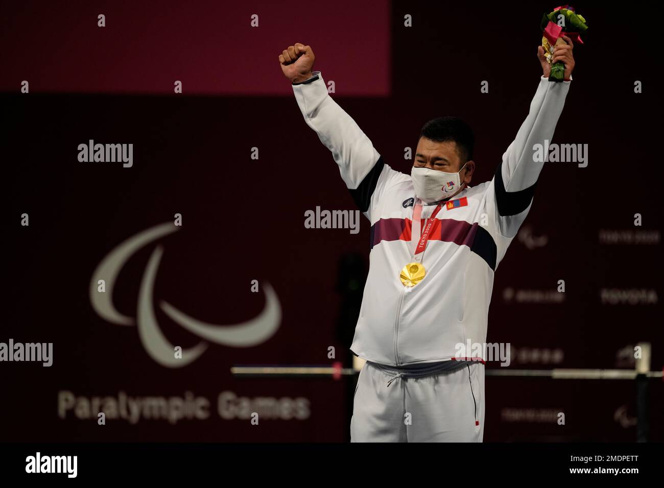 Mongolia's Sodnompiljee Enkhbayar celebrates after winning a cold medal