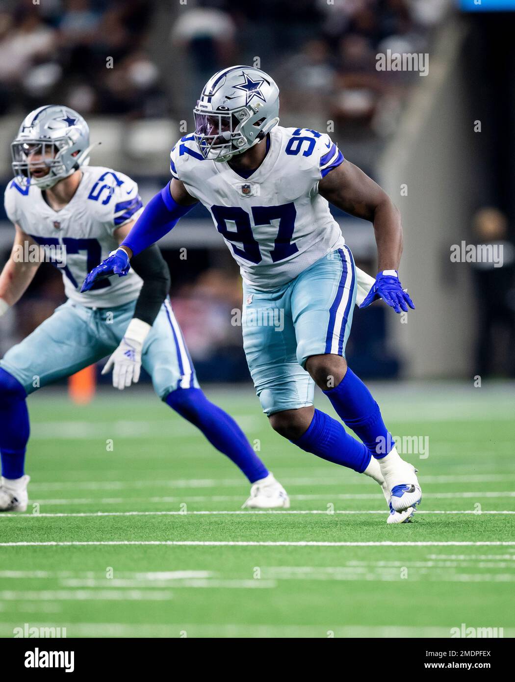 Dallas Cowboys defensive end Ron'Dell Carter (97) points during an NFL  preseason football game against the Houston Texans, Saturday, Aug 21, 2021,  in Arlington, Texas. Houston won 20-14. (AP Photo/Brandon Wade Stock