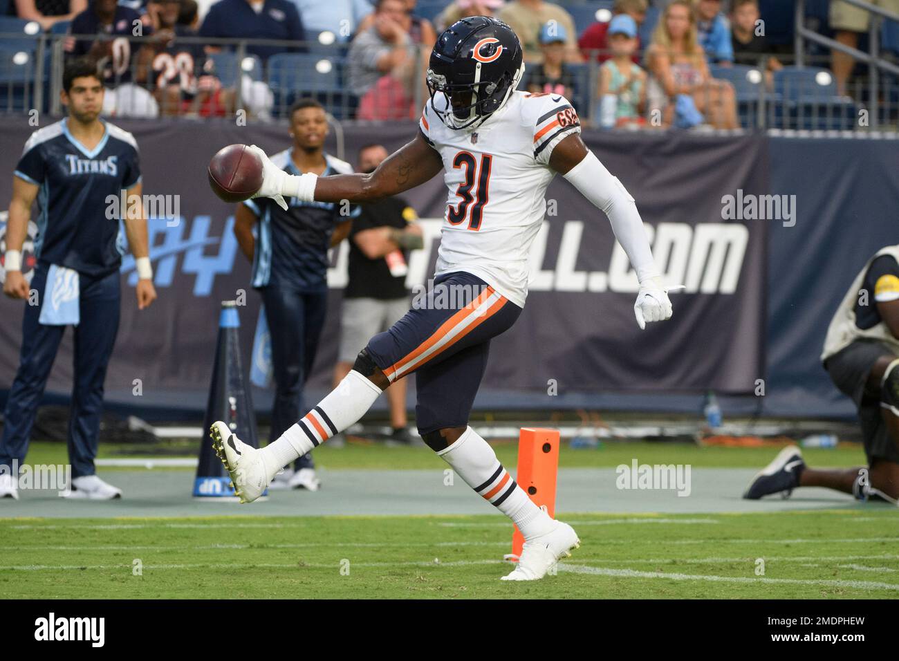 Chicago Bears defensive back Tre Roberson, left, scores a touchdown after  intercepting a pass against the Tennessee Titans in the first half of a  preseason NFL football game Saturday, Aug. 28, 2021