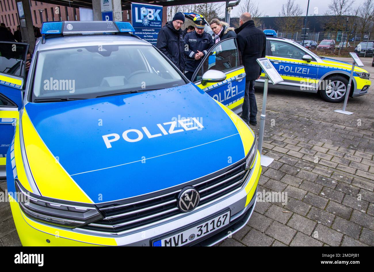 Schwerin, Germany. 23rd Jan, 2023. Christian Pegel (SPD, l), the Interior  Minister of Mecklenburg-Western Pomerania, stands during the handover of a  total of 24 new radio patrol cars for various police inspectorates