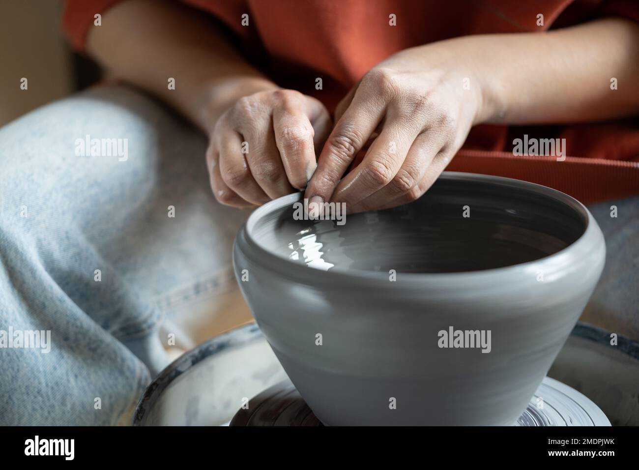 Stressrelieving hobbies, female hands molding wet clay on wheel Stock Photo Alamy