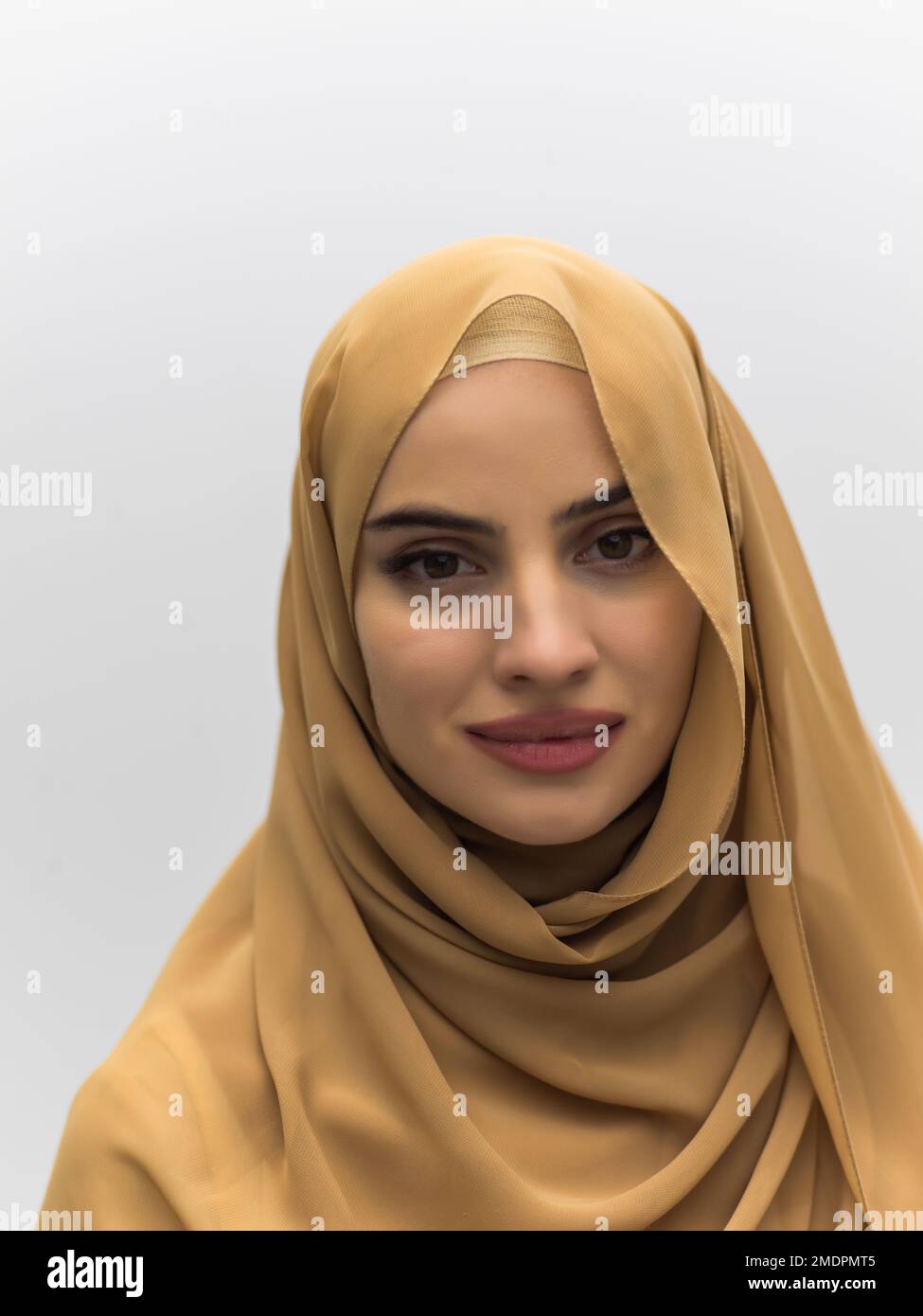Portrait of young muslim woman wearing hijab on isolated white ...