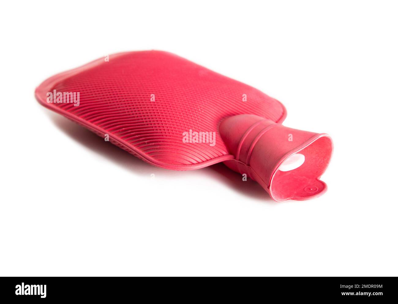Red medical heating pad with hot water on a white background, isolate