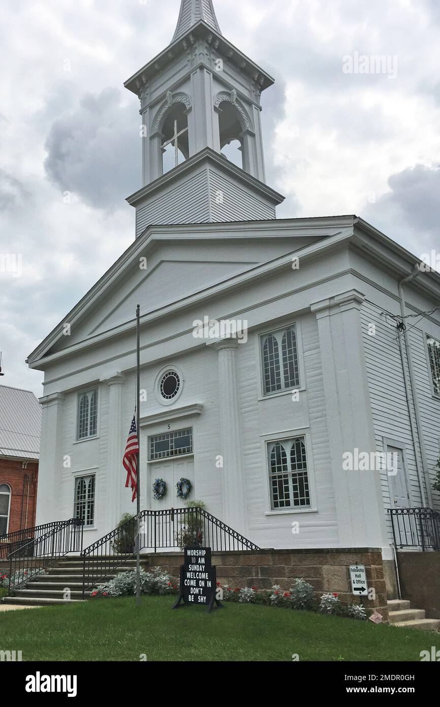 A flag rests at halfstaff outside the United Church of Christ in