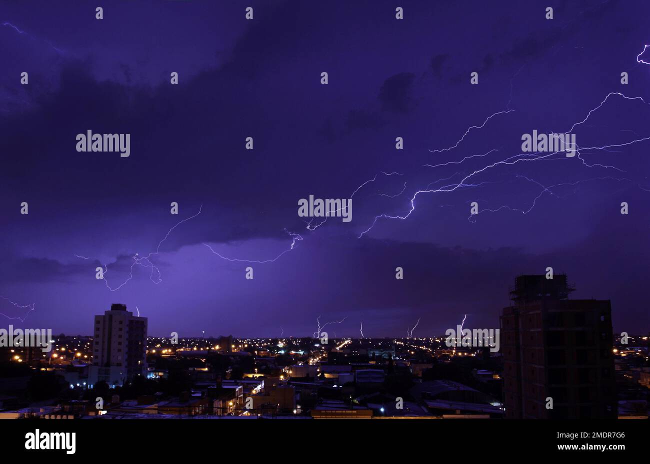 The bright blizzards in the night sky above the city Stock Photo - Alamy