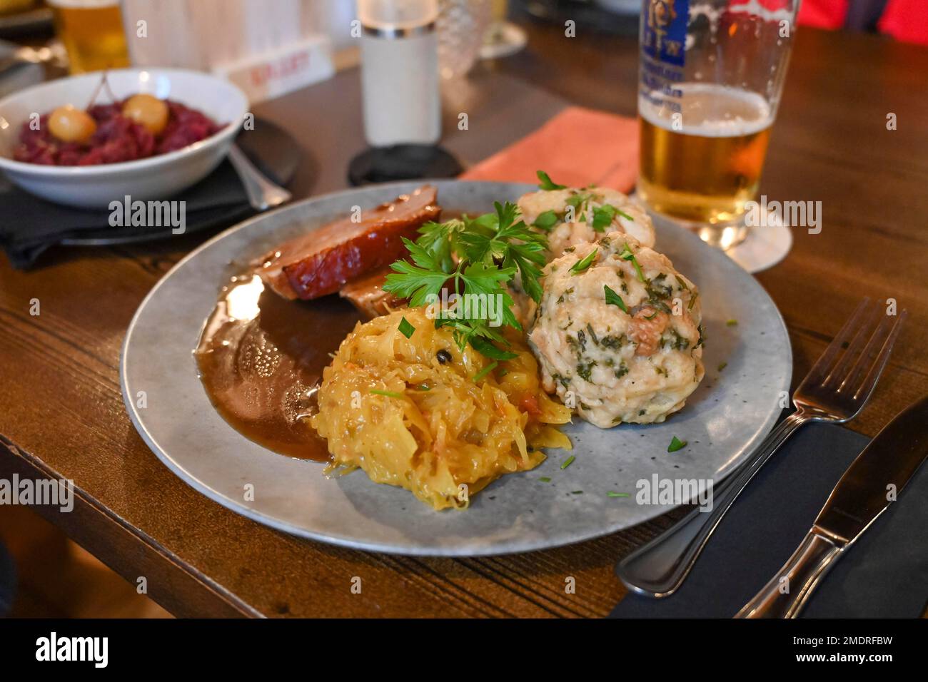 Roast pork with bread dumplings and sauerkraut Stock Photo Alamy