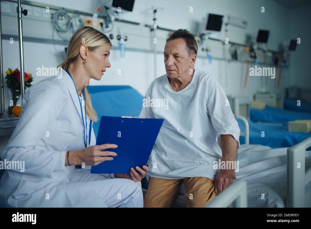 Young woman doctor explaining diagnosis to her patient. Stock Photo