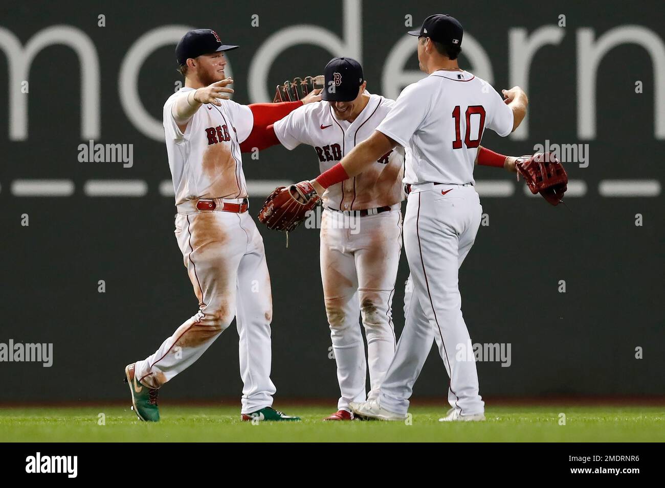 Boston Red Sox outfielders, from left, Alex Verdugo, Enrique Hernandez