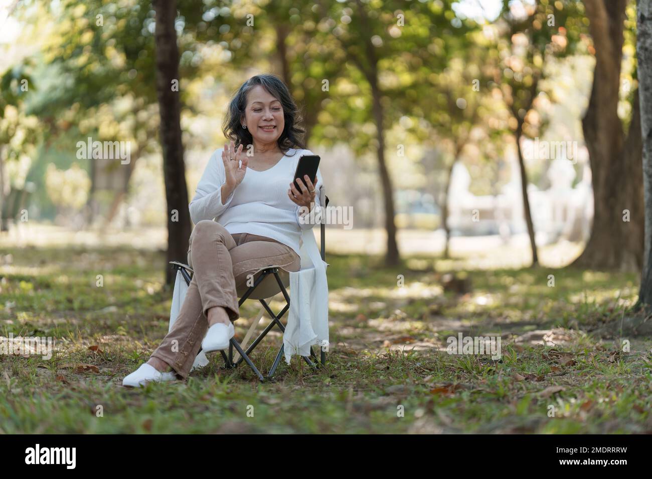 Happy older woman outdoor hi-res stock photography and images - Alamy