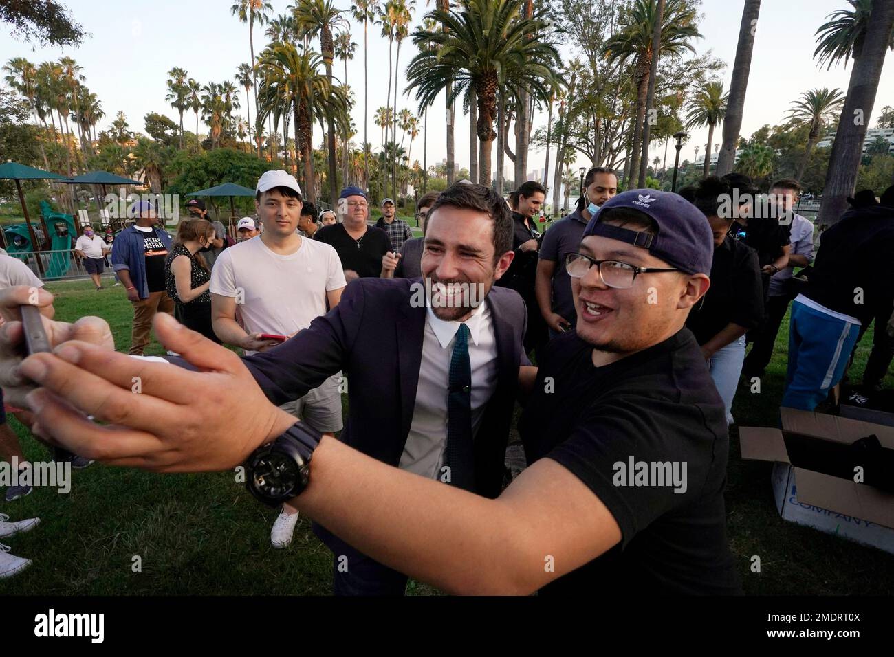 In this Friday, Aug, 20, 2021, Kevin Paffrath, center, a real estate