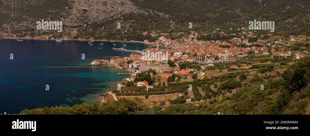 KOMIZA, CROATIA, EUROPE - Panorama of coastal town of Komiza, on the island of Vis, in the Adriatic Sea. Stock Photo