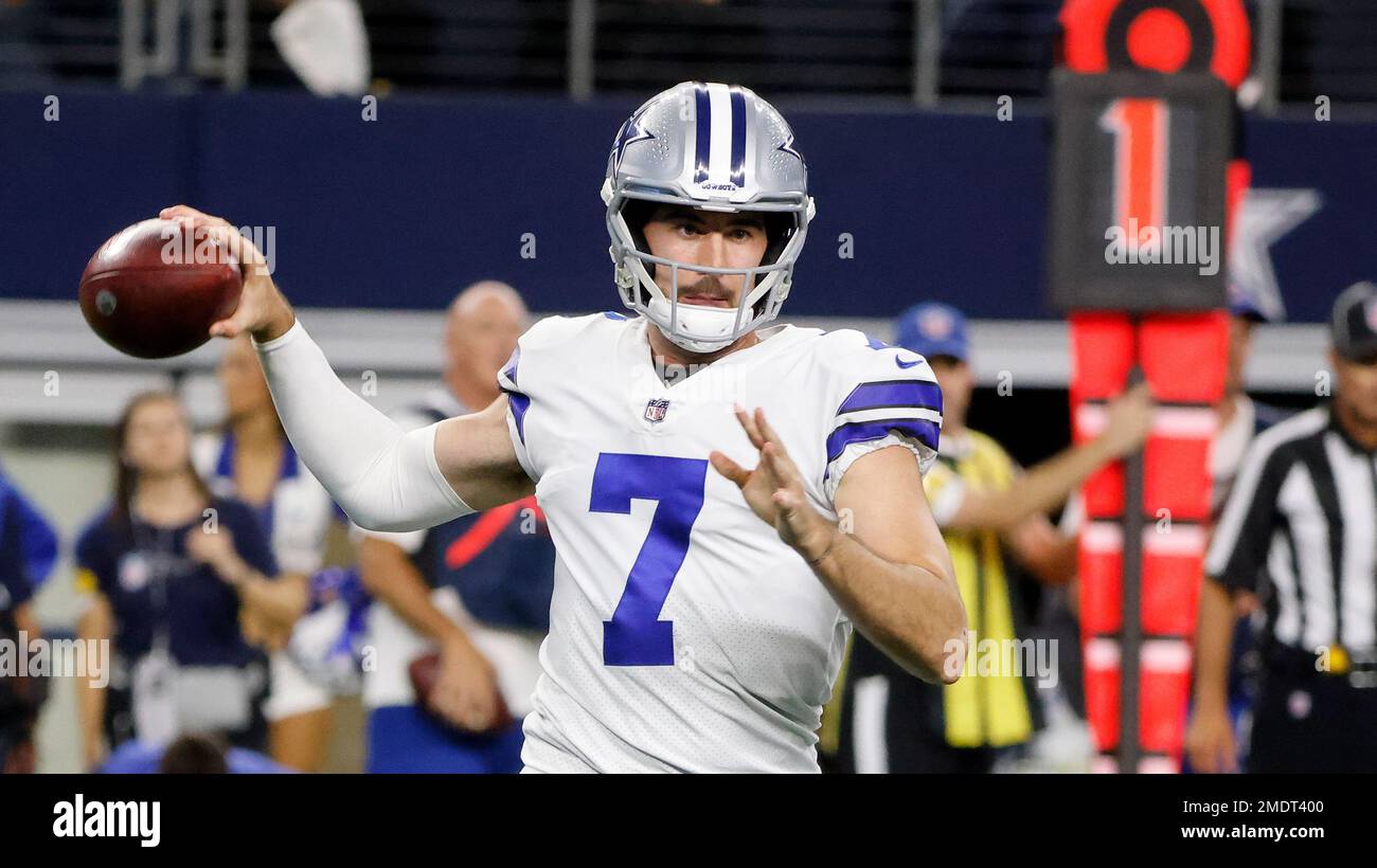 Dallas Cowboys quarterback Ben DiNucci, front left, takes a snap