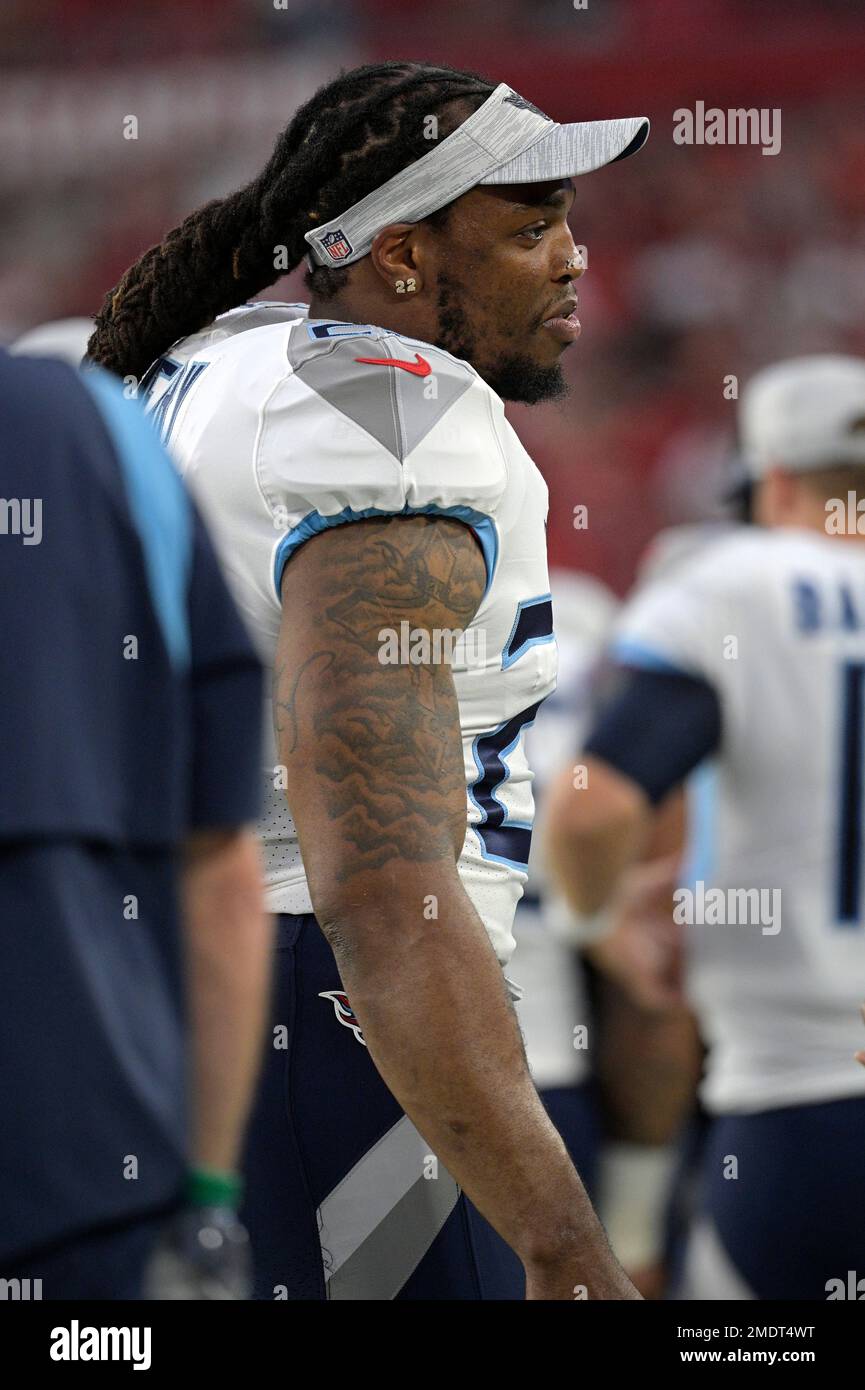 Tennessee Titans running back Derrick Henry watches from the sideline  during the first half of a preseason NFL football game against the Tampa  Bay Buccaneers, Saturday, Aug. 21, 2021, in Tampa, Fla. (