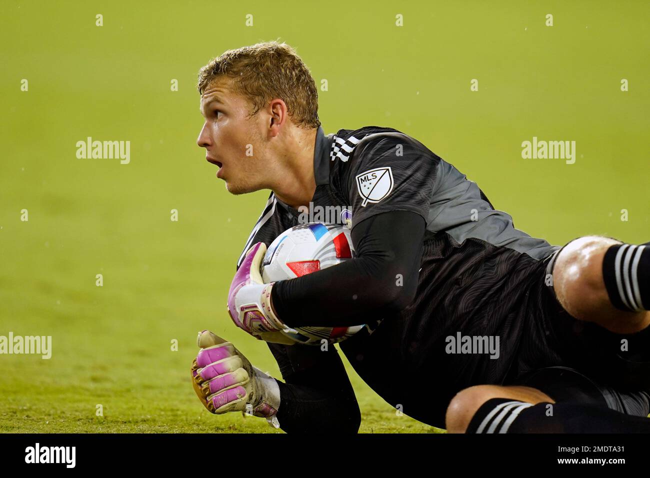 Orlando City goalkeeper Mason Stajduhar blocks a shot by the Chicago Fire during the first half