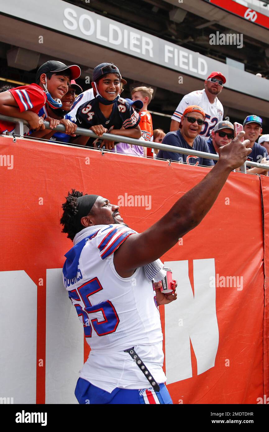 Buffalo Bills defensive end Jerry Hughes (55) takes a selfie with fans  during the first half of a preseason NFL football game against the Chicago  Bears, Saturday, Aug. 21, 2021, in Chicago. (