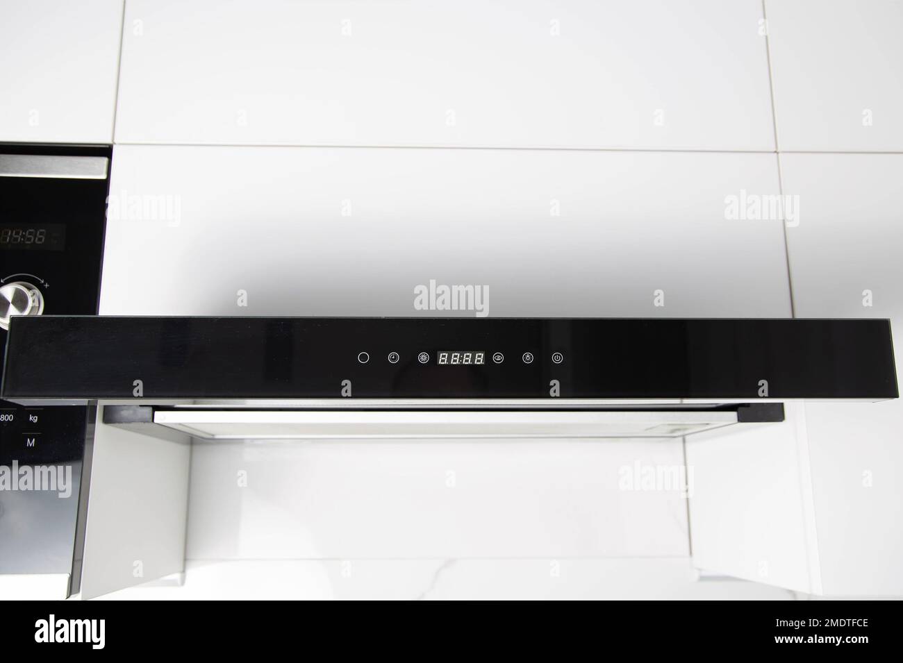 Modern stylish kitchen hood with touch control. Black range hood in a