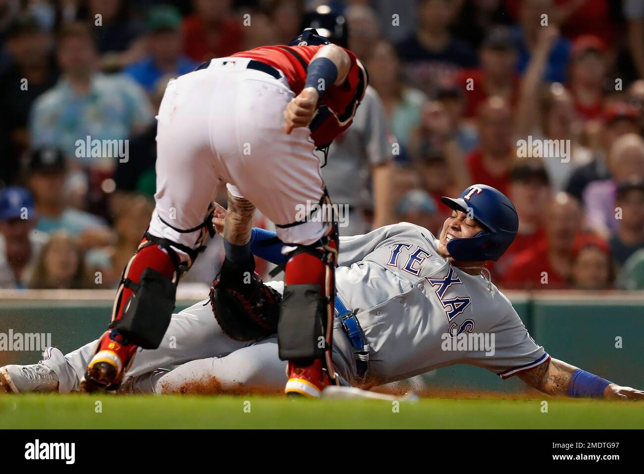 Texas Rangers' Yohel Pozo, right, beats the tag from Boston Red Sox's  Christian Vazquez at home plate on a single by Brock Holt during the second  inning of a baseball game, Saturday