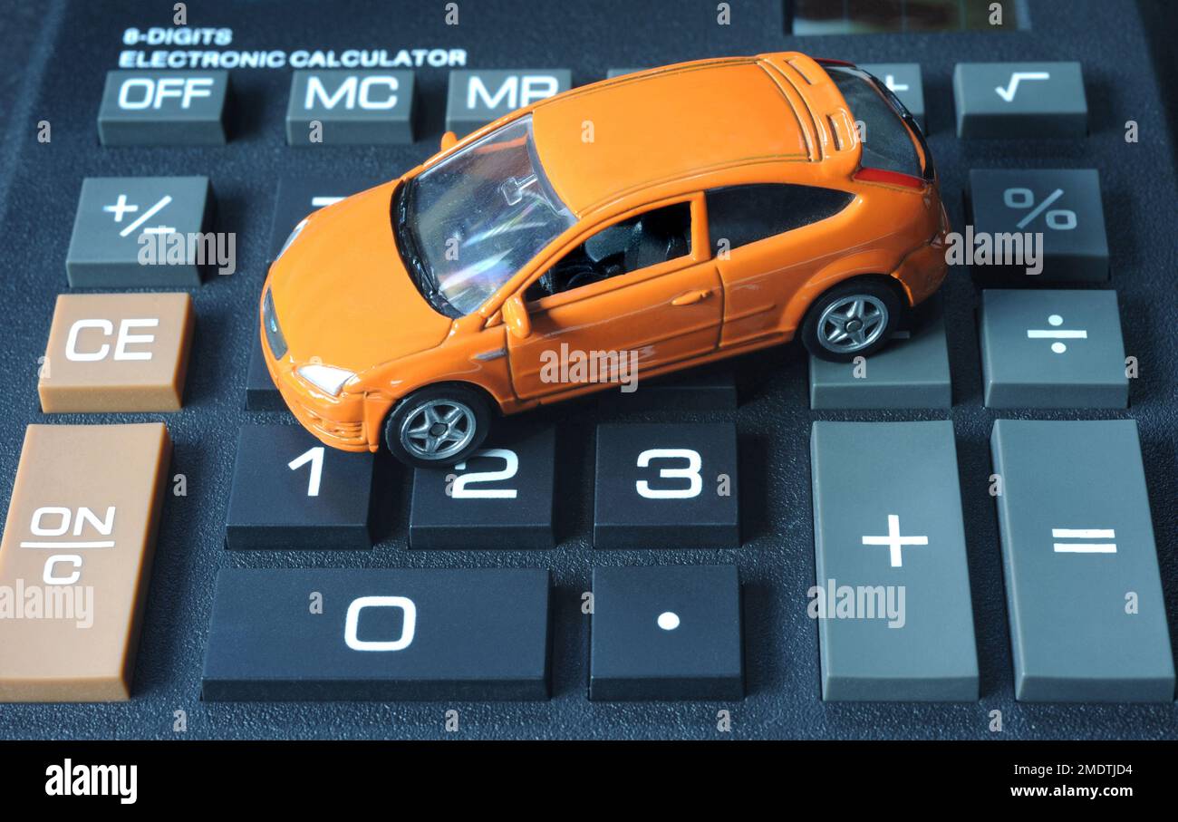 MODEL HATCHBACK CAR ON CALCULATOR RE COST OF MOTORING DRIVERS COSTS NEW CAR PRICES SECOND HAND CARS ETC UK Stock Photo