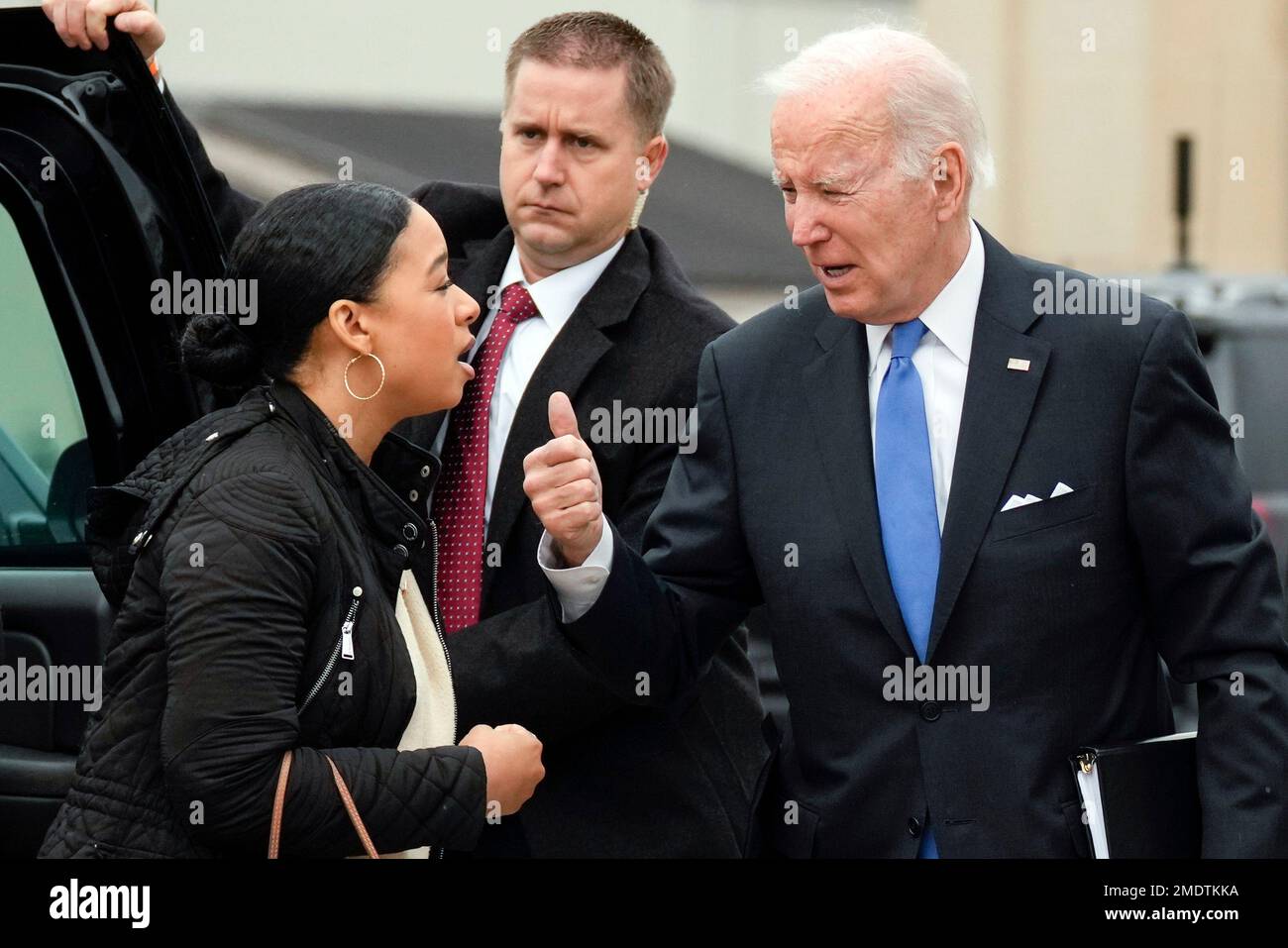 President Joe Biden talks with Ashley Williams, special assistant to