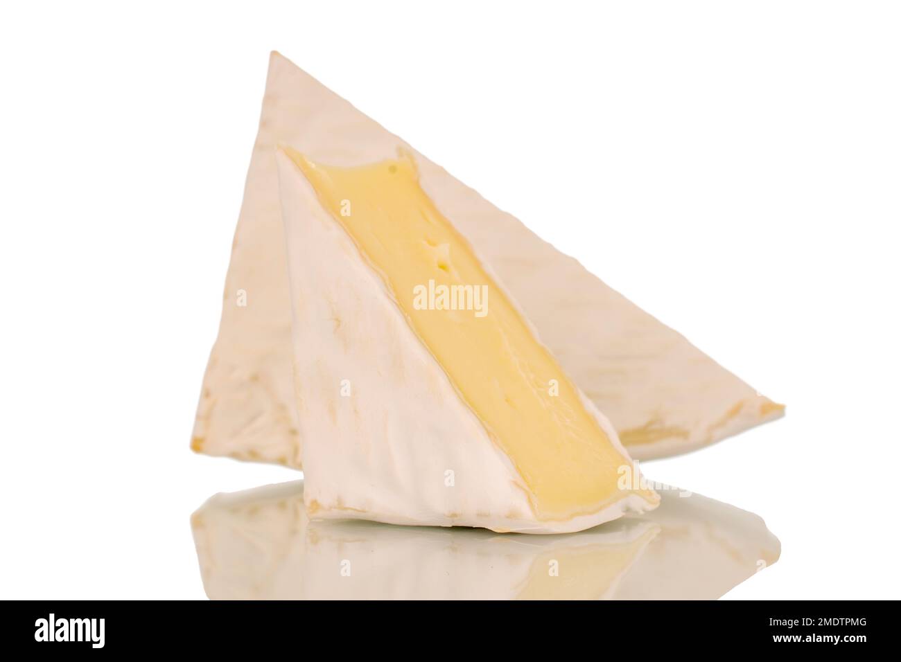 Two pieces of fragrant brie cheese, macro, isolated on white background