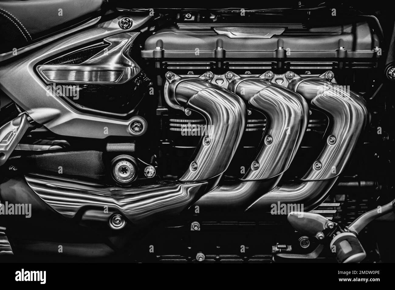 Motorcycle engine. Closeup superbike engine exhaust pipes art photography in black and white vintage Stock Photo