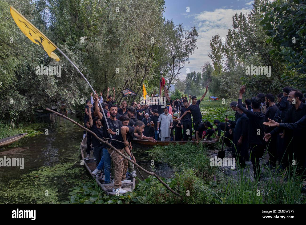 Kashmiri Shiite Muslims shout religious slogans as they participate in ...