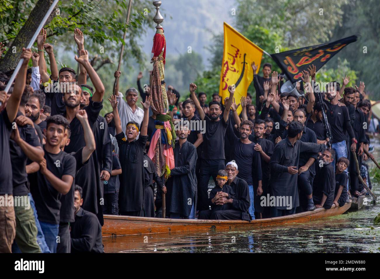 Kashmiri Shiite Muslims shout religious slogans as they participate in ...